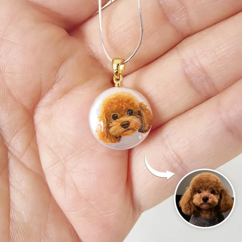 Dog pendant necklace held in a hand with close-up inset